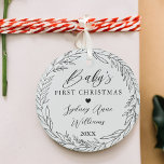 Baby's First Christmas Newborn Keepsake Wreath Glass Ornament<br><div class="desc">Special keepsake ornament to commemorate baby's first Christmas. Design features a simple floral wreath design with "Baby's First Christmas" displayed in elegant script and serif text pairing. Personalize with the baby's name and the year. Make a very special gift!</div>