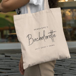 Bachelorette | Modern Minimalist Script Bridesmaid Tote Bag<br><div class="desc">This Bachelorette Party custom design features a handwritten script typography. You can easily personalize the bride-to-be's name,  date,  bridemaid's name or your custom message! The perfect elegant accessory for a bachelorette party or bachelorette weekend!</div>