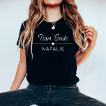 Bachelorette Party Team Bride Personalized Bridal T-Shirt<br><div class="desc">Elevate your bachelorette party style with our Team Bride Personalized Bridal T-Shirt in a chic and bold dark color, adorned with striking white prints. Designed for the bride and her squad, these dark-colored shirts add a touch of sophistication to your celebration while maintaining a sense of fun and unity. The...</div>