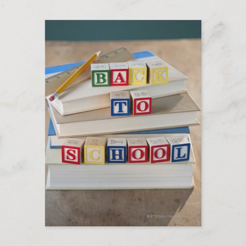Back to school building blocks on stacked books postcard