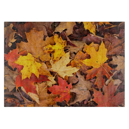 Background Of Colorful Autumn Leaves On Forest Cutting Board