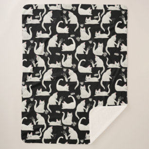 Bad Cats Knocking Stuff Over, White Cats on Black Sherpa Blanket
