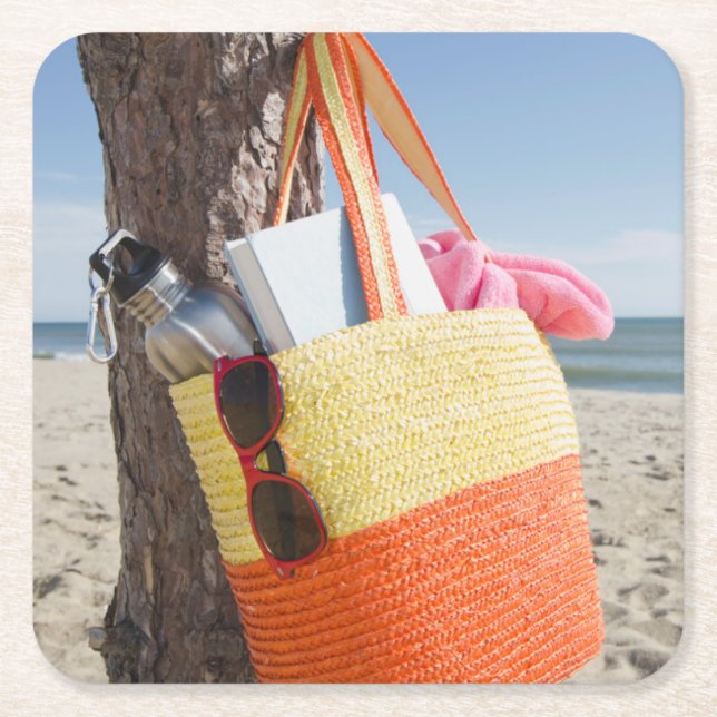 Bag Hanging On Tree Trunk At Sandy Beach Square Paper Coaster (Front)