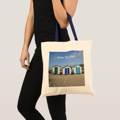 bag with beach huts blue sky sand english seaside