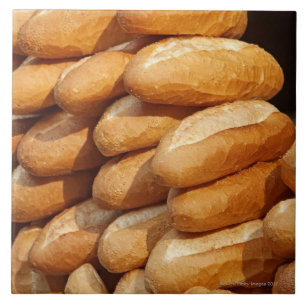 Baguette, bread, for sale in street by hawker. tile