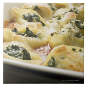 Baked pasta shells with spinach filling tile