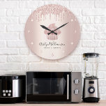 Bakery Cupcake Pastry Chef Rose Gold Glitter Drips Large Clock<br><div class="desc">Make a stylish impression with this elegant, sophisticated, simple, and modern custom name wall clock. A sparkly, rose gold cupcake, script handwritten typography and glitter drips overlay a faux metallic rose gold ombre background. Personalize with your full name, business, or other info. Your choice of a round or square clock...</div>