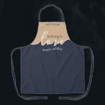 Baking is Love made Edible Fathers Day Apron<br><div class="desc">Father's Day Gift tof the Dad who loves to bake! Baking is Love Made Edible. NAVY & TAN. Clean Modern Script design.Your Homemade Baking frame-worthy. Sign his masterpiece with a flourish with this understated classy ALL-OVER PRINT APRON.. This design Coordinates with our Artisan Dough Covers--which you can find here: https://www.zazzle.com/collections/rising_bread_dough_cover_great_gift_for_bakers-119097812462675619...</div>