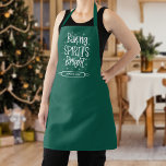 Baking Spirits Bright Green Personalized Christmas Apron<br><div class="desc">Festive holiday apron featuring the phrase "Baking Spirits Bright" in white, hand-lettered text accented by white stars and snow (dots). Personalize the green holiday apron by adding your name inside of the the rolling pin frame. Perfect to wear for all of your holiday parties and dinners. The personalized Christmas apron...</div>