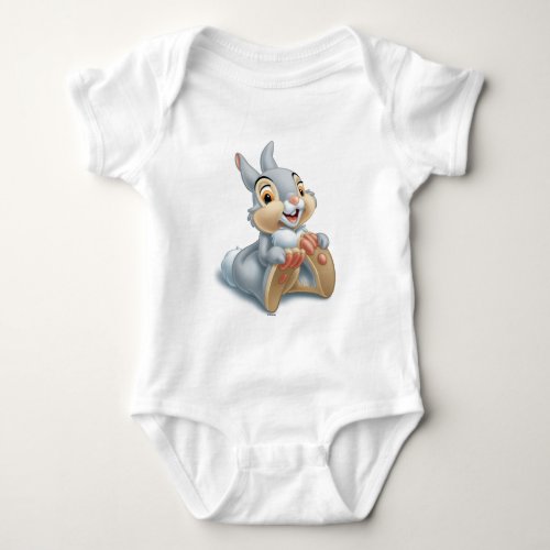 Bambis Thumper Holding His Feet Baby Bodysuit