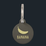 Banana Pet ID Tag<br><div class="desc">Give your pet a bunch of style with this Banana Pet ID Tag! A simple, minimalist design showcases a ripe banana against a sleek background, perfect for the pet that loves a playful twist on the classics. Not only will your furry friend be the talk of the dog park, but...</div>