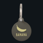 Banana Pet ID Tag<br><div class="desc">Give your pet a bunch of style with this Banana Pet ID Tag! A simple, minimalist design showcases a ripe banana against a sleek background, perfect for the pet that loves a playful twist on the classics. Not only will your furry friend be the talk of the dog park, but...</div>