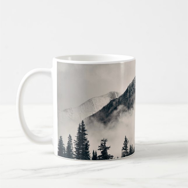 Banff national park foggy mountains and forest in  coffee mug (Left)