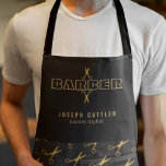 Barber name gold scissors pattern barbershop black apron<br><div class="desc">Personalized barber stylist apron with faux gold bold typography script logo and with the barber's name and title over black scissors patterned background.           Perfect for a professional men salon employee look.</div>