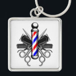 Barbershop Logo Keychain<br><div class="desc">Barbershop logo style design with classic red, white and blue striped barber pole standing proud in center. Barber life tools of the trade in back. Illustrated tools include crossed hair clippers, crossed barber scissors and black combs.</div>