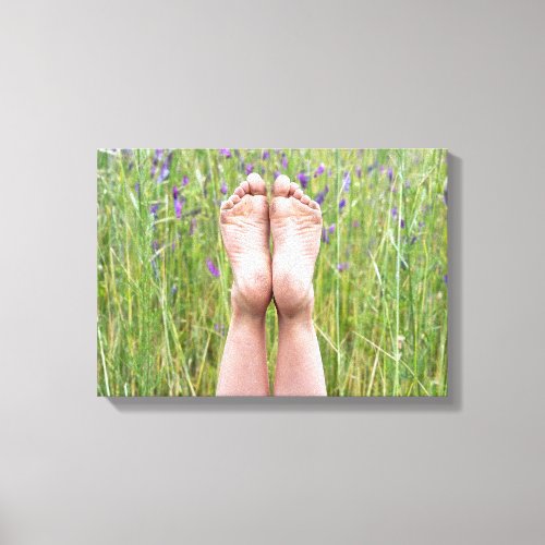 bare feet in meadow wildflowers canvas print