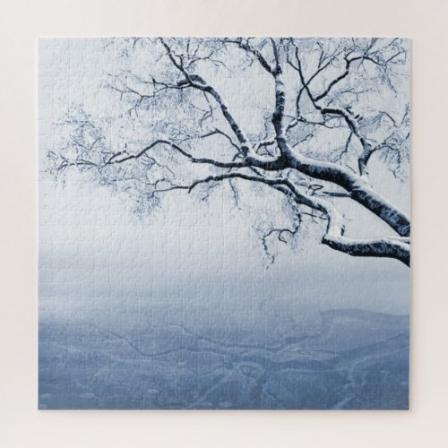 Bare winter tree branch above a frozen lake jigsaw puzzle