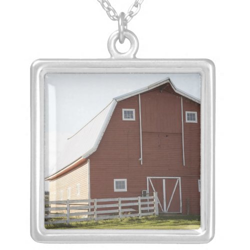 Barn in rural landscape silver plated necklace