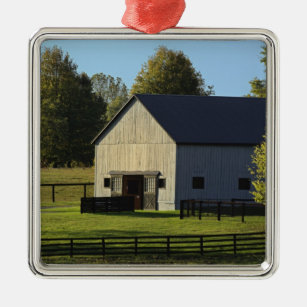 Barn on thoroughbred horse farm at sunrise, metal ornament