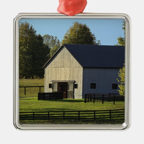 Barn on thoroughbred horse farm at sunrise metal ornament