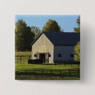 Barn on thoroughbred horse farm at sunrise, pinback button