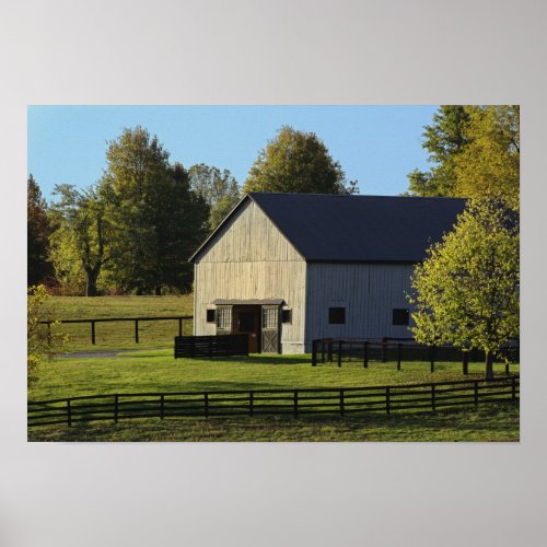 Barn on thoroughbred horse farm at sunrise poster