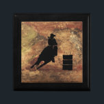 Barrel Racing Girl Silhouette on a Grunge Texture Keepsake Box<br><div class="desc">Exciting and rustic rodeo themed illustration. Silhouette of a cowgirl barrel racing with her horse. Background is a rough weathered brown and red toned earthy grunge texture. Great for rodeo enthusiasts and horse lovers.</div>