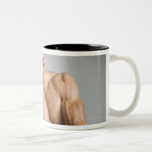 Baseball player with bare chest warming up with Two_Tone coffee mug