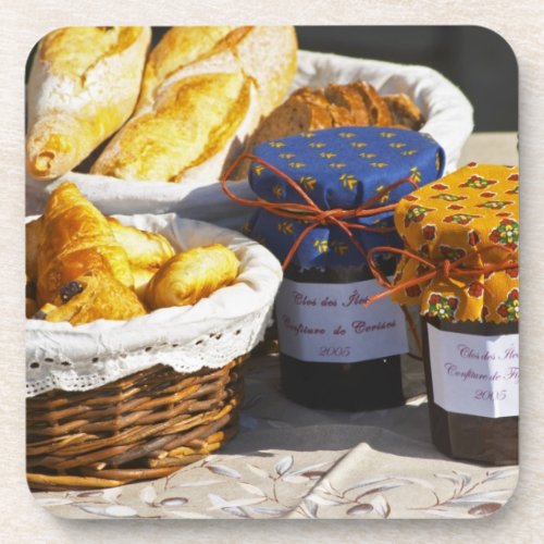 Basket with croissants and chocolate breads coaster