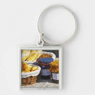 Basket with croissants and chocolate breads. keychain