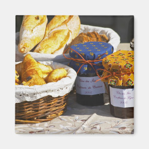 Basket with croissants and chocolate breads. magnet
