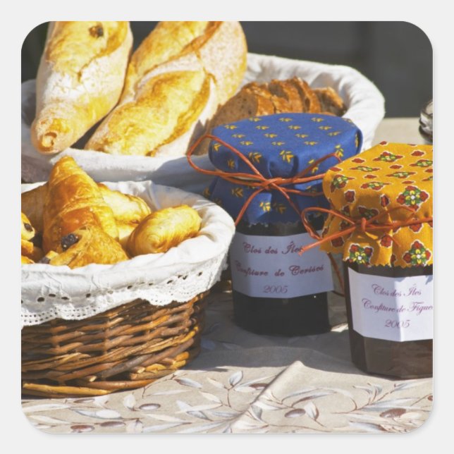 Basket with croissants and chocolate breads. square sticker (Front)