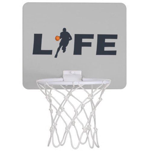 Basketball player dribble with orange ball mini basketball hoop