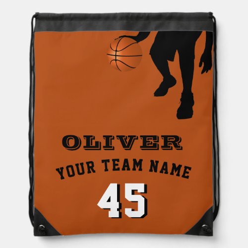 Basketball Player Team Name Number Orange Drawstring Bag - Basketball Player Team Name Number Orange Drawstring bag. The design has a black silhouette of a basketball player with a basketball. The text is in modern fonts - personalize it with your team name, number and your name. Perfect for basketball players.