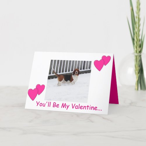 Basset hound in snow on funny Valentines Day card