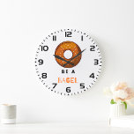 Be a Bagel Funny Food Pun Bagel Lover Design  Large Clock<br><div class="desc">Add a touch of humor to your space with this “Be a Bagel” wall clock. Featuring a playful bagel illustration and a witty pun, this clock is perfect for food lovers, brunch enthusiasts, and anyone who enjoys quirky decor. Made with high-quality materials and a sleek design, it’s a fun and...</div>