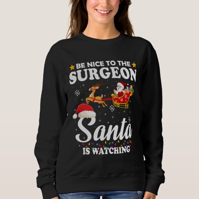 Be Nice To The Surgeon Santa Watching Xmas Sweatshirt (Front)