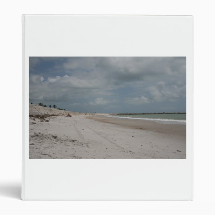 Beach and dune and jetty empty except one vinyl binder