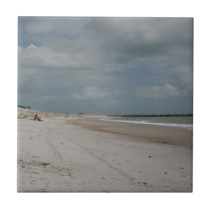 Beach and dune and jetty empty except one ceramic tile