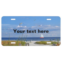 Beach and Ocean View with Sailboat