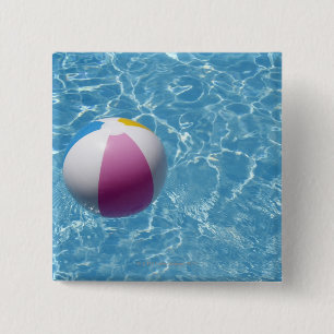 Beach ball in swimming pool button