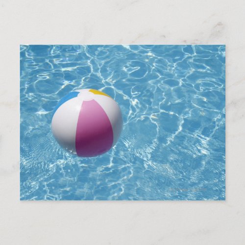 Beach ball in swimming pool postcard