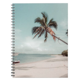 Beach beside coconut palm tree notebook