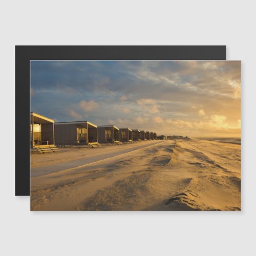 Beach cabins at sunset at the dutch coast magnetic invitation