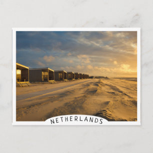 Beach cabins at sunset at the dutch coast postcard