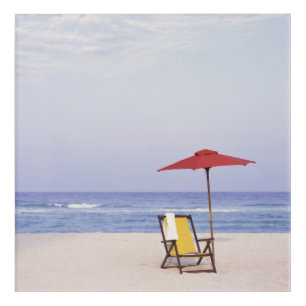 Beach Chair And Umbrella By Ocean Acrylic Print