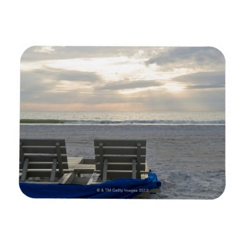 Beach chairs on St Petes beach at sunset Magnet