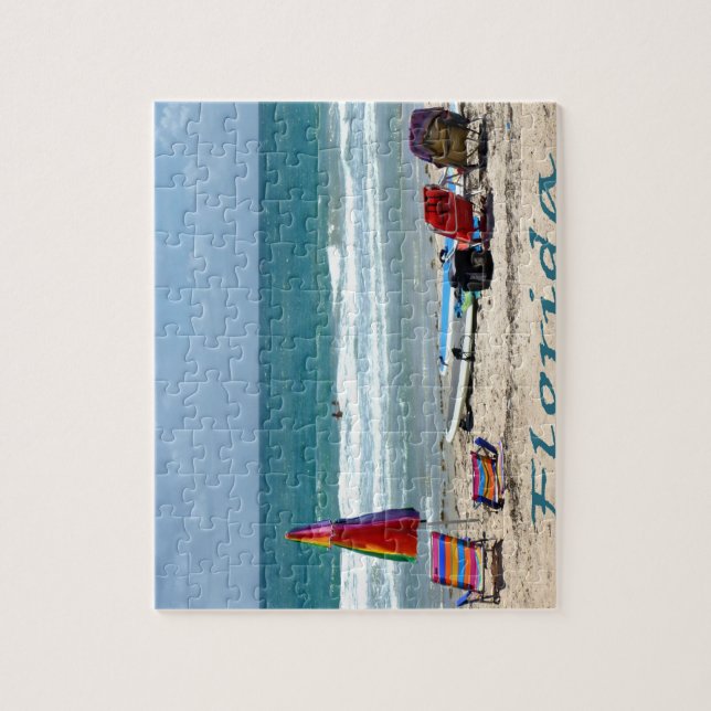 beach chairs surfboards umbrellas sand ocean jigsaw puzzle (Vertical)