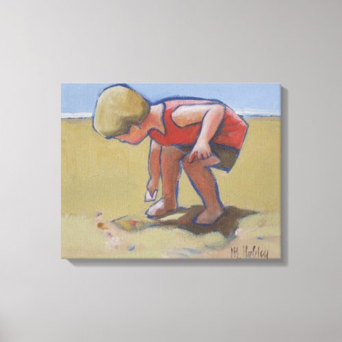 Beach child boy findng shell in the sand canvas print