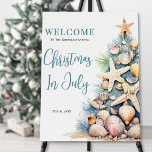 Beach Christmas Is July Welcome Sign<br><div class="desc">Welcome guests to your holiday gathering with this festive and beachy Christmas in July welcome sign. The design features a large Christmas tree on the right made of beach shells, starfish, and coral, bringing a fun coastal touch to your celebration. The tree's soft green, tan, and coral-red details pair perfectly...</div>